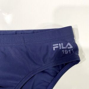 COPY - FILA swim brief boys size. See pic for size info.NWOT. Color dark blues.